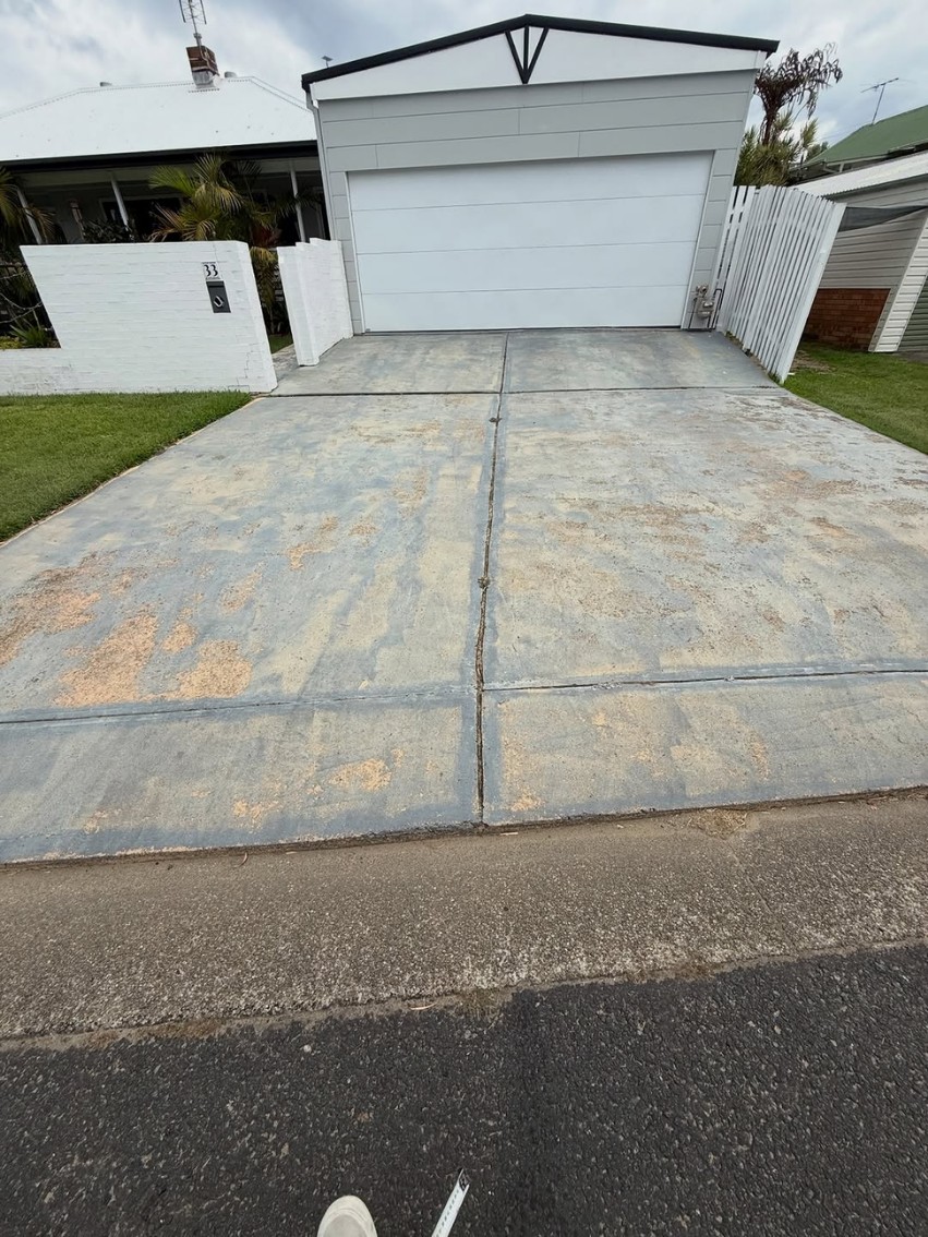 Worn concrete driveway before Allsorts coating preparation